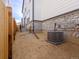 The house has a fenced in side yard and an AC unit at 22435 E 7Th Pl, Aurora, CO 80018
