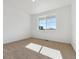 Bright bedroom with neutral carpet and a large window providing natural light at 4730 Hatcher Dr, Brighton, CO 80601