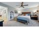 Neutral bedroom featuring a ceiling fan, bed, and carpet at 8470 Arriba Dr, Littleton, CO 80125