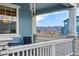 Inviting covered front porch with mountain views, perfect for relaxing outdoors at 8470 Arriba Dr, Littleton, CO 80125