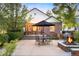 Charming brick house with a patio, fire pit, and outdoor seating area at 628 Cherry St, Denver, CO 80220