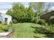Well-maintained backyard with lush greenery and a spacious lawn area at 628 Cherry St, Denver, CO 80220