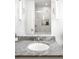 Bathroom with granite countertop, vessel sink, modern fixtures, and updated shower at 628 Cherry St, Denver, CO 80220
