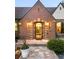 Charming brick home with a well-maintained front yard and welcoming entrance exudes warmth and curb appeal at 628 Cherry St, Denver, CO 80220