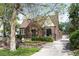 Classic brick home with mature landscaping, walkway, and a driveway at 628 Cherry St, Denver, CO 80220