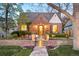 Charming brick home with landscaped front yard and inviting stone pathway, showcasing classic curb appeal at 628 Cherry St, Denver, CO 80220