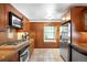 Functional kitchen showcasing modern stainless steel appliances, wooden cabinets, and practical design for everyday cooking at 628 Cherry St, Denver, CO 80220