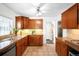 Functional kitchen with tile flooring, ample counter space, wooden cabinets, and stainless steel appliances for efficient cooking at 628 Cherry St, Denver, CO 80220