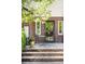 A brick patio with outdoor seating offers relaxation and privacy at 628 Cherry St, Denver, CO 80220