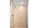 Neutral-toned tiled stand-up shower with a glass door and modern fixtures at 628 Cherry St, Denver, CO 80220