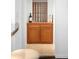 Cozy wine storage with wooden shelving and a cabinet for storing bottles and accessories at 628 Cherry St, Denver, CO 80220