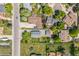 Aerial image of the property in a neighborhood with mature landscaping, showing its yard, and surrounding streets at 7340 W 32Nd Ave, Wheat Ridge, CO 80033