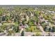 Aerial view of the neighborhood with tree coverage, showcasing the property's location and community setting at 7340 W 32Nd Ave, Wheat Ridge, CO 80033