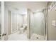 Updated bathroom featuring glass shower, white tile and flooring at 7340 W 32Nd Ave, Wheat Ridge, CO 80033