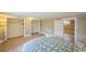 Bedroom features wood-look floors and large closets at 7340 W 32Nd Ave, Wheat Ridge, CO 80033