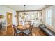 Dining room with decorative wooden beams and view into the kitchen at 7340 W 32Nd Ave, Wheat Ridge, CO 80033