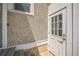 Exterior shot of home with a white door and stucco wall at 7340 W 32Nd Ave, Wheat Ridge, CO 80033