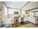Bright kitchen with stainless steel appliances and subway tile backsplash at 7340 W 32Nd Ave, Wheat Ridge, CO 80033