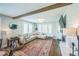 Comfortable living area with fireplace and large windows at 7340 W 32Nd Ave, Wheat Ridge, CO 80033