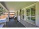 Inviting front porch with seating area and natural light at 7340 W 32Nd Ave, Wheat Ridge, CO 80033