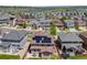 Aerial view of home with solar panels, patio, and spacious backyard in a suburban neighborhood at 7514 Blue Water Dr, Castle Rock, CO 80108