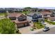 Aerial view of a two-story home with large driveway and well-maintained yard at 7514 Blue Water Dr, Castle Rock, CO 80108