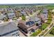 Aerial view of a home with solar panels and landscaped backyard in a suburban community at 7514 Blue Water Dr, Castle Rock, CO 80108