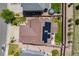 A birdseye view showcases the home's solar panels, landscaping, and backyard with trampoline at 7514 Blue Water Dr, Castle Rock, CO 80108