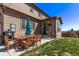 Back patio with table, grill and outdoor furniture at 7514 Blue Water Dr, Castle Rock, CO 80108