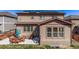 The home's backyard features a patio and green lawn area for outdoor enjoyment at 7514 Blue Water Dr, Castle Rock, CO 80108