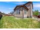 Lawn featuring well-kept grass, garden plot, lush bushes, and a wood fence at 7514 Blue Water Dr, Castle Rock, CO 80108