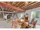 Spacious unfinished basement with exposed ceiling and support beams and room for dining table at 7514 Blue Water Dr, Castle Rock, CO 80108