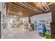 Unfinished basement featuring exposed beams, a support beam, wrapped walls, and an egress window at 7514 Blue Water Dr, Castle Rock, CO 80108