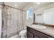 Functional bathroom with a shower-tub combination and single sink vanity, provides a well-lit and practical space at 7514 Blue Water Dr, Castle Rock, CO 80108
