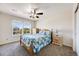 Bright bedroom featuring light wood furniture, and a large window offering natural light, creating a cozy space at 7514 Blue Water Dr, Castle Rock, CO 80108