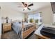 Inviting bedroom with wood furnishings and natural light, offering a cozy and comfortable space at 7514 Blue Water Dr, Castle Rock, CO 80108