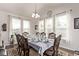 Formal dining room featuring an elegant chandelier and an expansive, set table at 7514 Blue Water Dr, Castle Rock, CO 80108