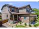 Charming two-story home with stone accents, covered porch, and three car garage at 7514 Blue Water Dr, Castle Rock, CO 80108