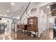 Welcoming foyer featuring wood floors, decorative furniture and staircase leading to the second floor at 7514 Blue Water Dr, Castle Rock, CO 80108