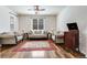 Cozy living room featuring a large window, hardwood floors, and elegant furnishings at 7514 Blue Water Dr, Castle Rock, CO 80108