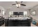 Comfortable main bedroom with large bed, neutral colors, and ceiling fan at 7514 Blue Water Dr, Castle Rock, CO 80108