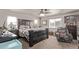 Serene main bedroom featuring a large bed, ceiling fan, and natural light at 7514 Blue Water Dr, Castle Rock, CO 80108