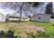 Lawn backyard featuring both grass and unkept foliage with a detached garage at 4164 W Eldorado Pl, Denver, CO 80236