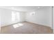 Well-lit, finished basement area with multiple windows at 4164 W Eldorado Pl, Denver, CO 80236
