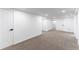 Finished basement area with access to a full bathroom at 4164 W Eldorado Pl, Denver, CO 80236