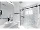 Contemporary bathroom featuring a glass shower, stylish fixtures, and marble accents for a luxurious feel at 4164 W Eldorado Pl, Denver, CO 80236