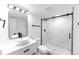 Modern bathroom with a sleek, glass-enclosed shower at 4164 W Eldorado Pl, Denver, CO 80236