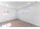 Bedroom with neutral paint, two windows, and carpet at 4164 W Eldorado Pl, Denver, CO 80236
