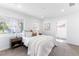 Bright bedroom features two windows, neutral decor, and a cozy atmosphere, perfect for relaxation at 4164 W Eldorado Pl, Denver, CO 80236