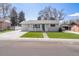 Charming single-story home featuring well-maintained lawn and welcoming front porch at 4164 W Eldorado Pl, Denver, CO 80236